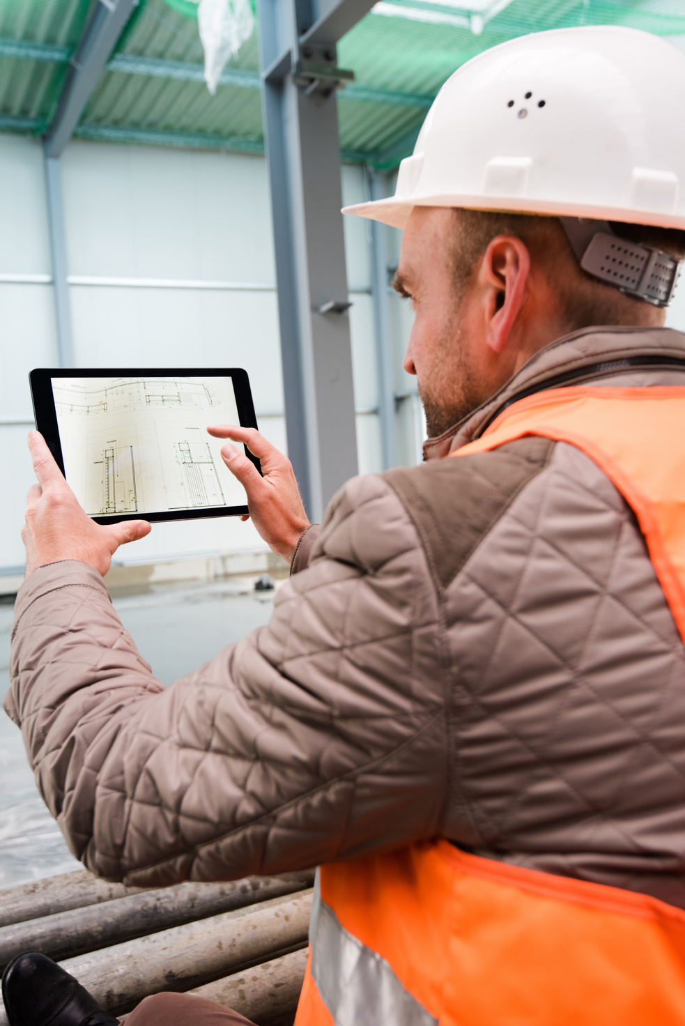 Construction Supervisor with Digital Tablet